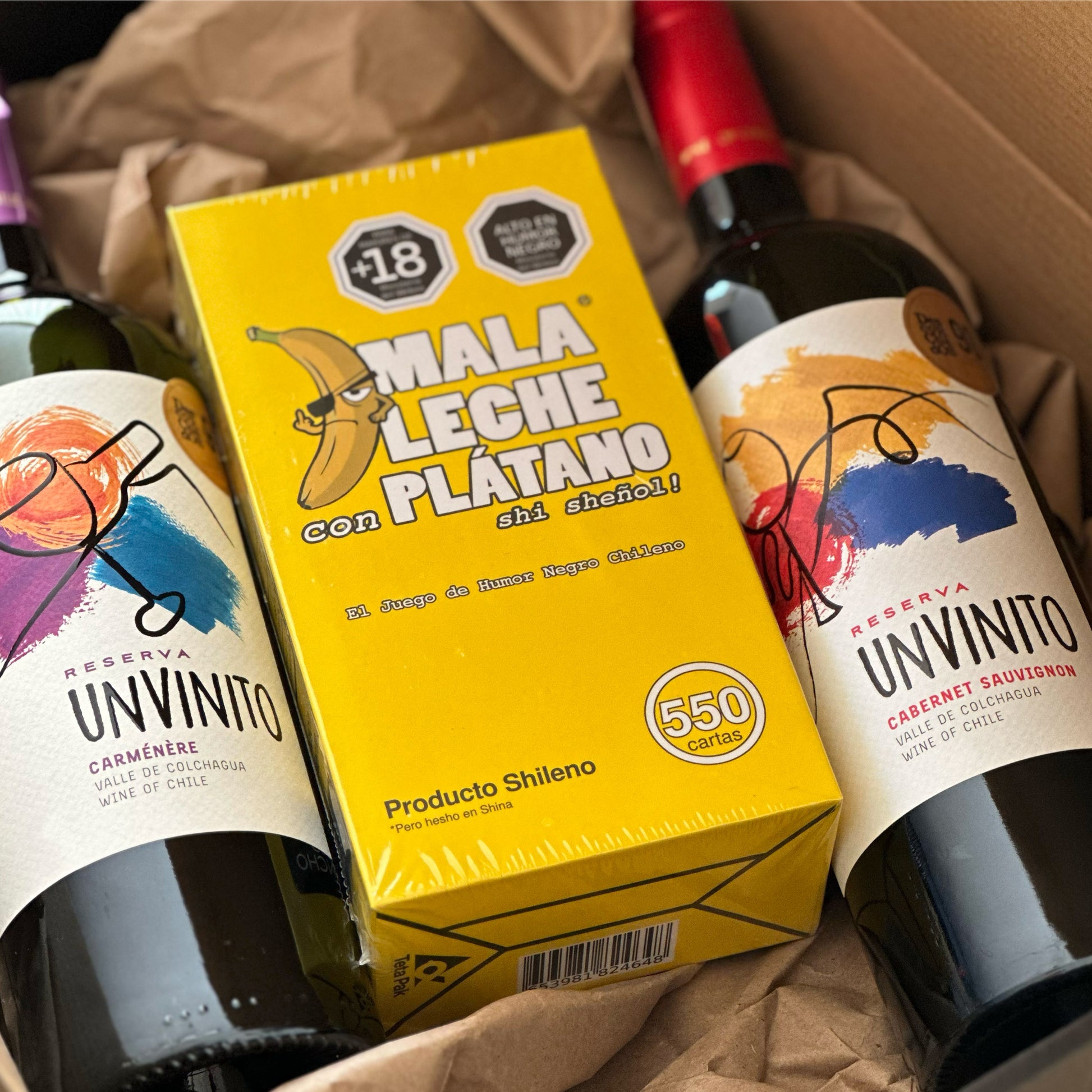 pack-caja-regalo-juego-mesa-mala-leche-con-platano-mas-2-unvinito-reserva